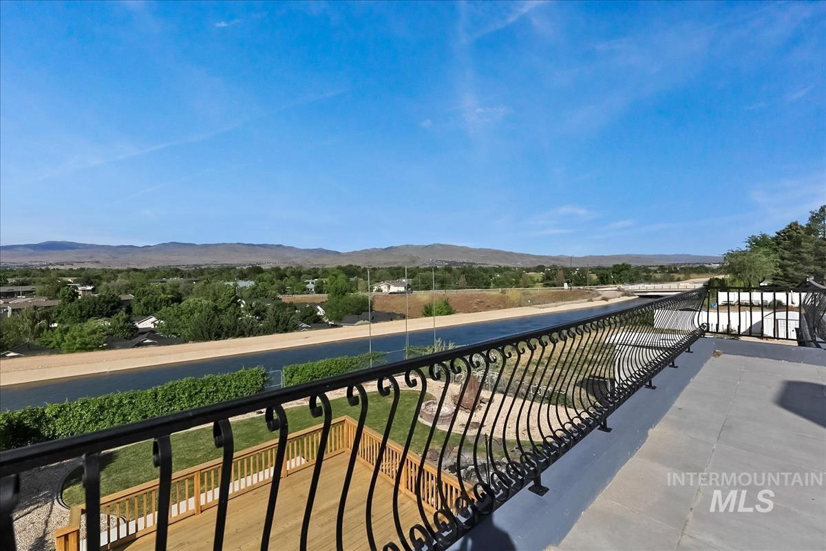 2804 West Sunrise Rim Road Boise, ID 83705 - Photo 44 of 50 Expansive outdoor deck featuring an ornate black wrought iron railing