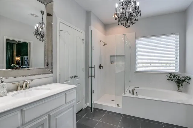 a bathroom with a double vanity sink mirror and