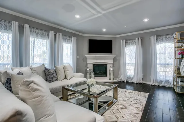 a living room with furniture fireplace and window