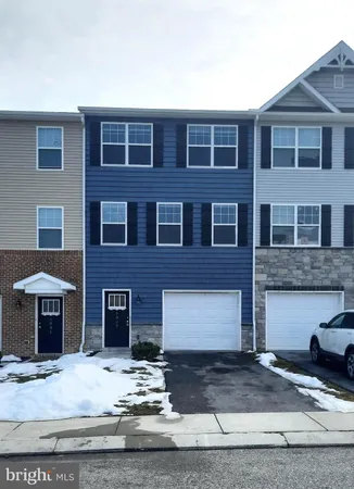 a front view of a house with yard