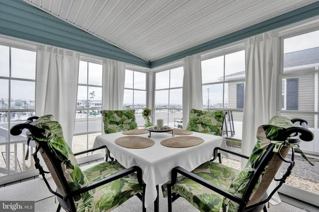 an outdoor space with furniture and garden