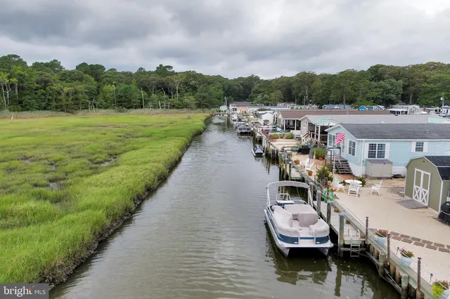a view of a patio with chairs and a table