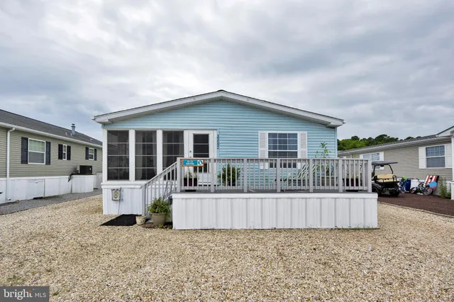 a garden with trees in the background
