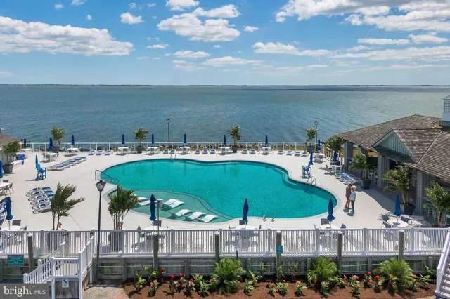 a kitchen with stainless steel appliances granite countertop a sink dishwasher and cabinets with wooden floor