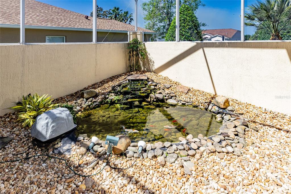 16299 Southwest 14th Avenue Road Ocala, FL 34473 - Photo 11 of 50 a view of a backyard with plants and a lake view