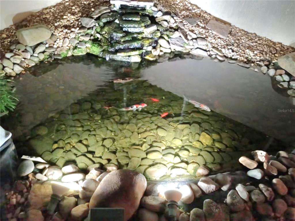 16299 Southwest 14th Avenue Road Ocala, FL 34473 - Photo 12 of 50 a backyard of a house with a yard and outdoor seating