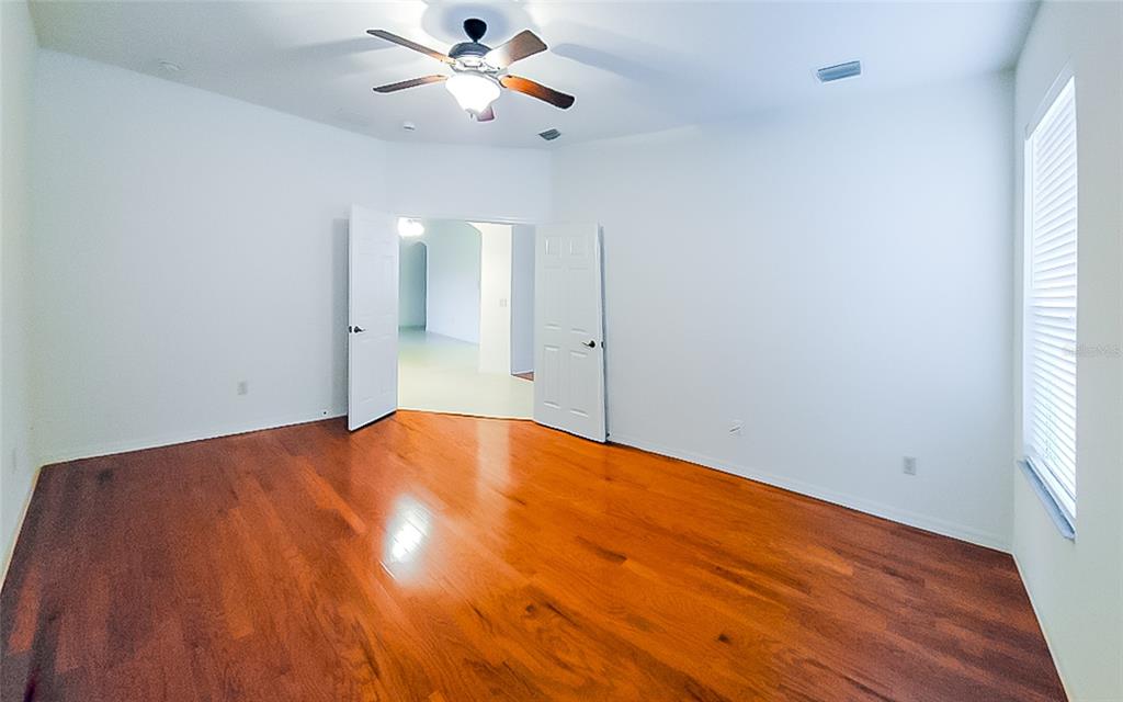 16299 Southwest 14th Avenue Road Ocala, FL 34473 - Photo 17 of 50 wooden floor in an empty room
