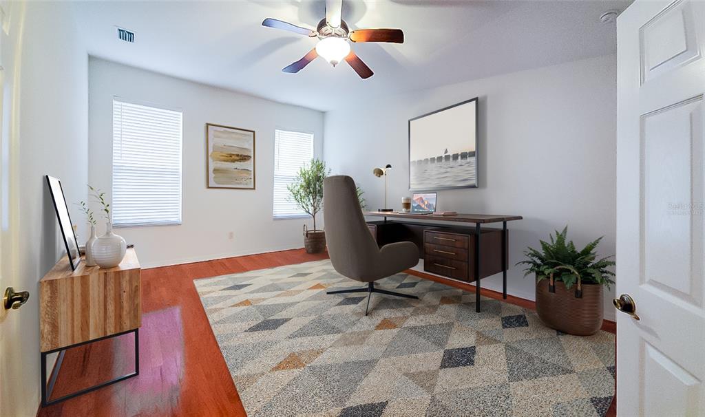 16299 Southwest 14th Avenue Road Ocala, FL 34473 - Photo 19 of 50 a workspace with furniture and wooden floor