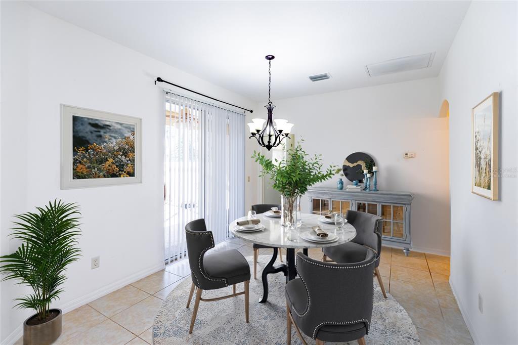 16299 Southwest 14th Avenue Road Ocala, FL 34473 - Photo 27 of 50 a dining room with furniture and window