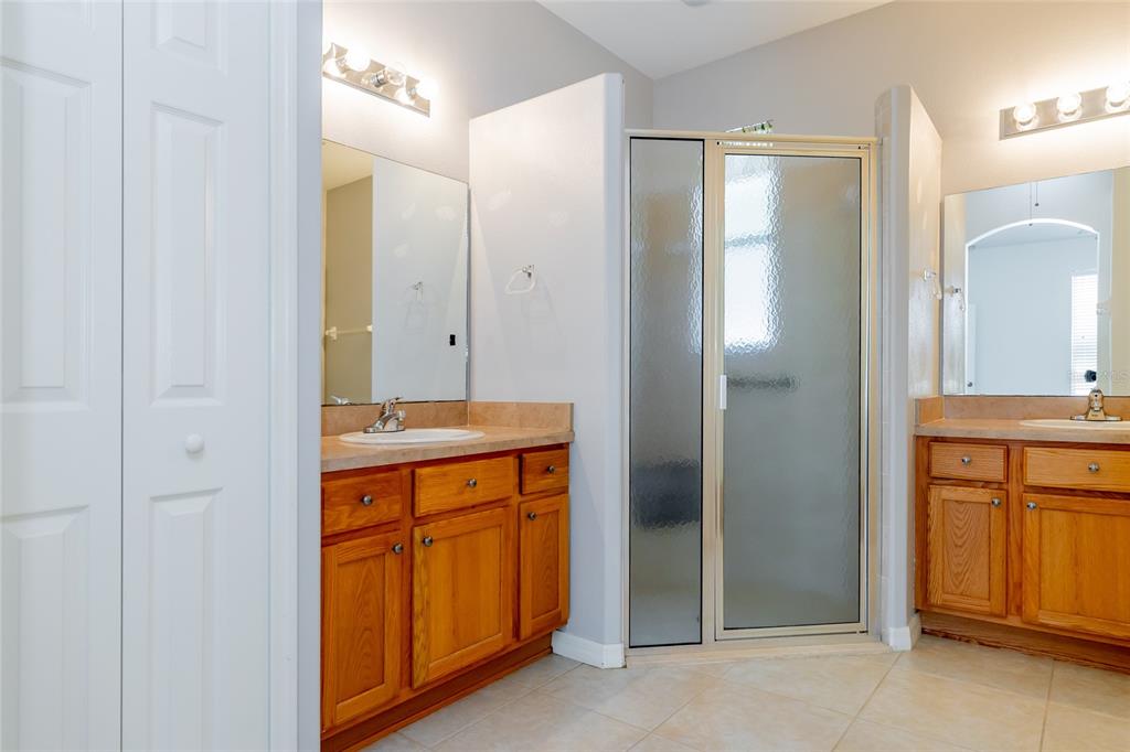 16299 Southwest 14th Avenue Road Ocala, FL 34473 - Photo 31 of 50 a bathroom with a granite countertop sink and a mirror