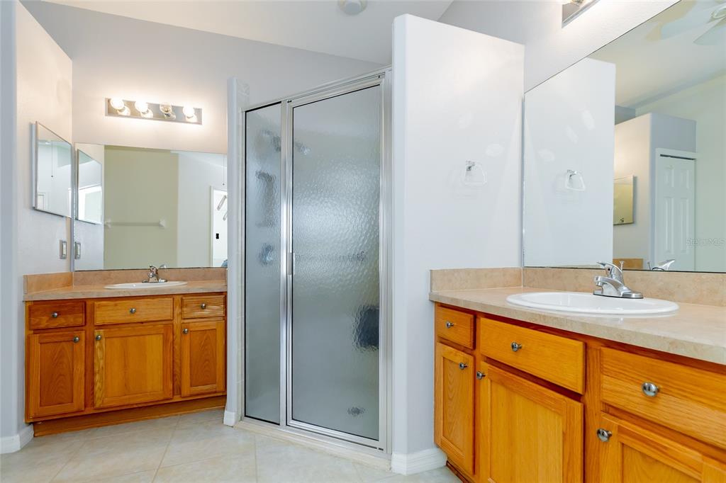 16299 Southwest 14th Avenue Road Ocala, FL 34473 - Photo 32 of 50 a bathroom with a granite countertop sink and a mirror