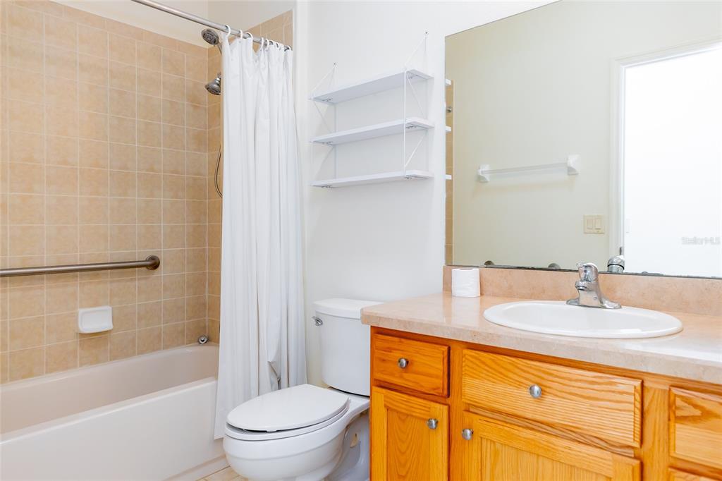 16299 Southwest 14th Avenue Road Ocala, FL 34473 - Photo 37 of 50 a bathroom with a sink toilet and shower