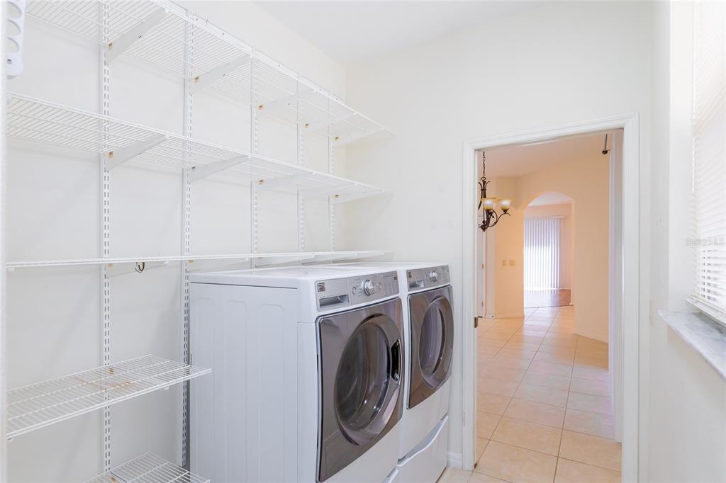 16299 Southwest 14th Avenue Road Ocala, FL 34473 - Photo 38 of 50 a view of a storage and utility room with washer and dryer