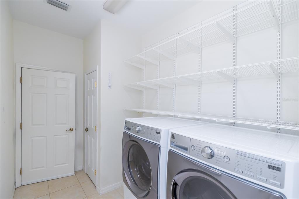 16299 Southwest 14th Avenue Road Ocala, FL 34473 - Photo 39 of 50 a utility room with dryer and washer