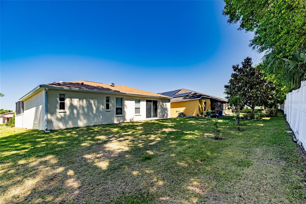 16299 Southwest 14th Avenue Road Ocala, FL 34473 - Photo 41 of 50 a front view of a house with a yard