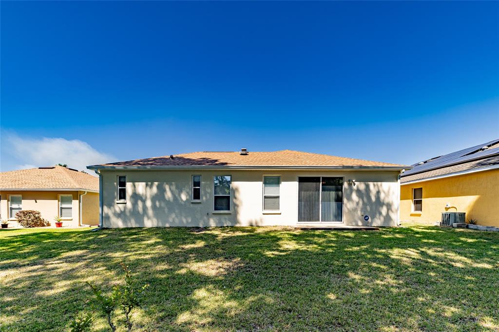 16299 Southwest 14th Avenue Road Ocala, FL 34473 - Photo 42 of 50 a front view of a house with a garden