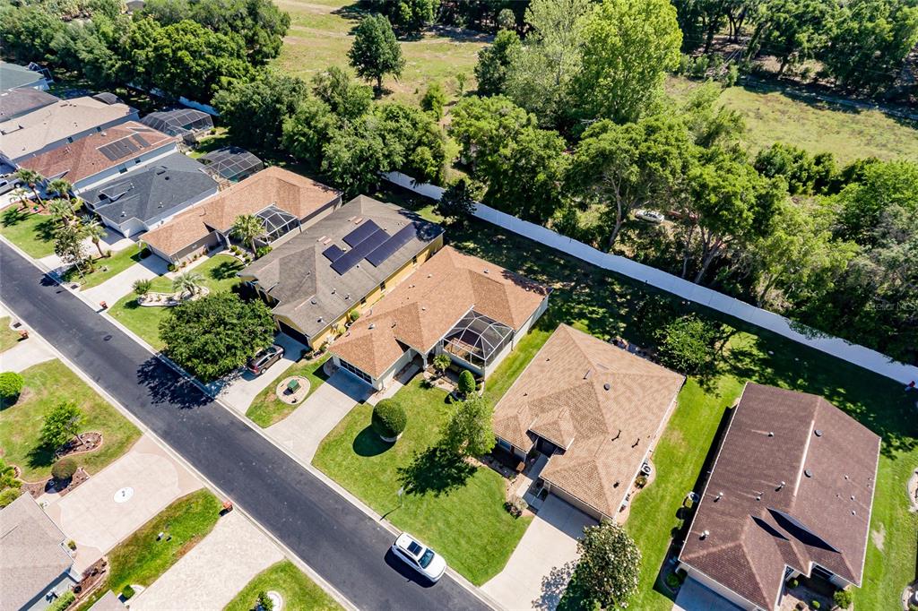 16299 Southwest 14th Avenue Road Ocala, FL 34473 - Photo 46 of 50 an aerial view of a house with a garden and lake view
