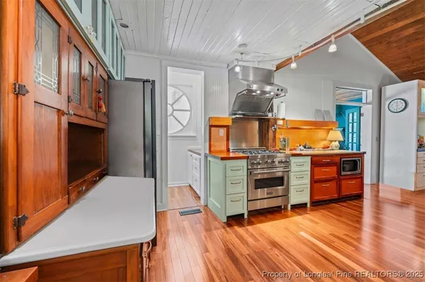 a view of balcony with wooden floor and fence