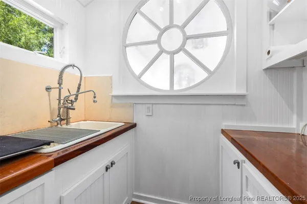 a view of a garden with large trees