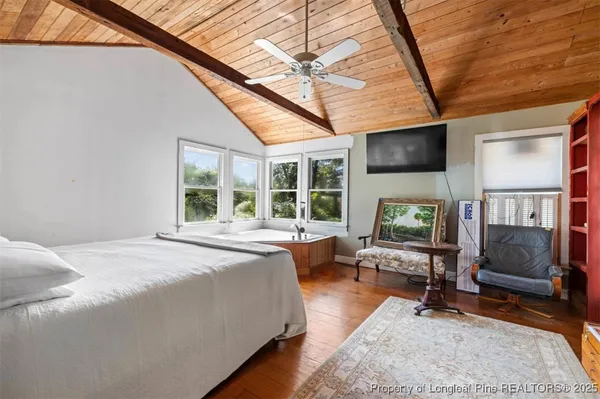 a bathroom with a toilet a sink and a window