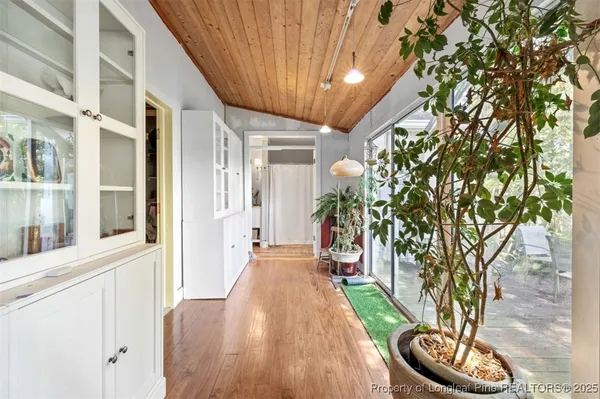 a bedroom with a large bed and flat tv