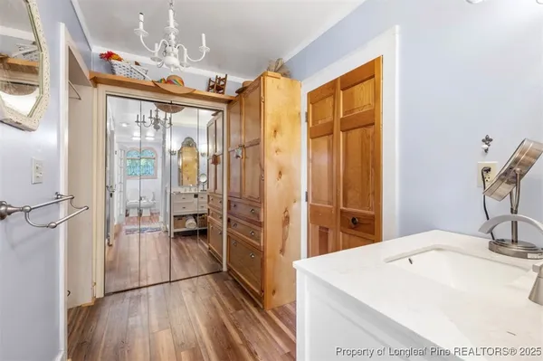 a bathroom with a toilet a sink and a window