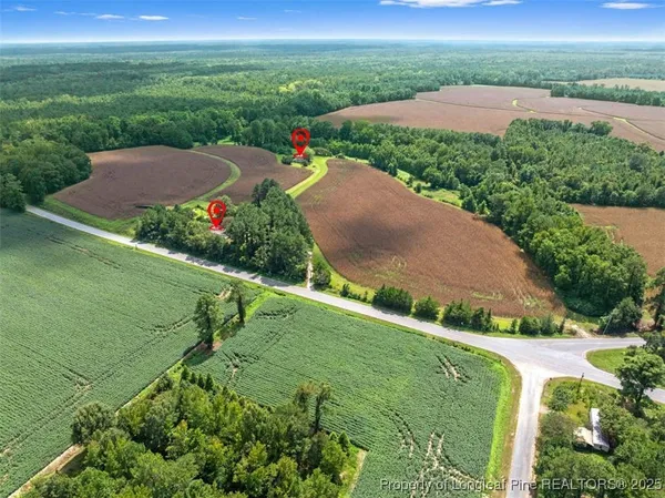 a view of a house with a barbeque and wooden floor and fence
