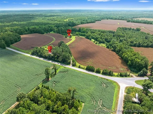 a view of a house with a barbeque and wooden floor and fence