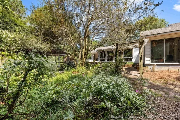 a living room with fireplace furniture and a flat screen tv