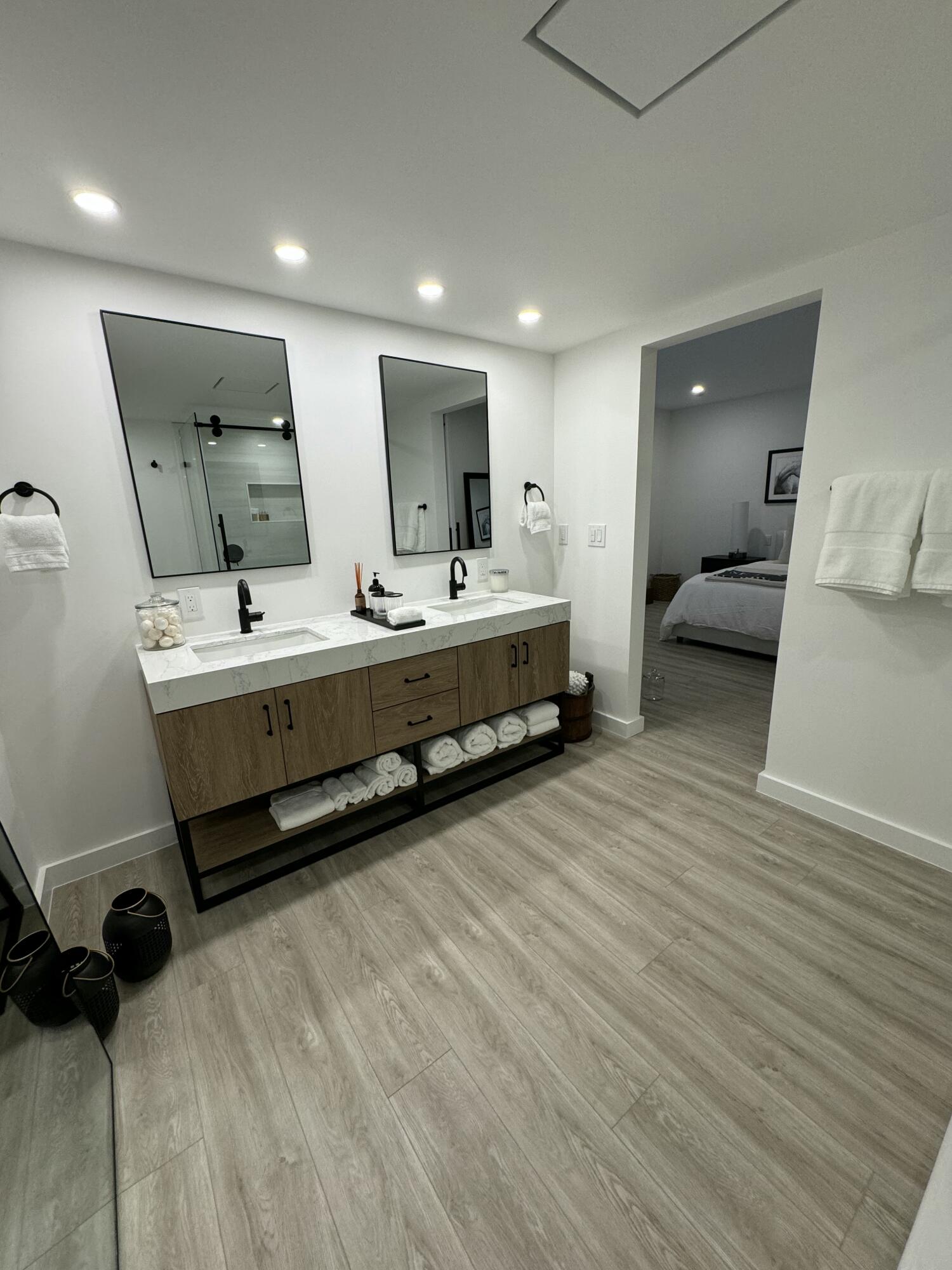 13400 Polo Road West Wellington, FL 33414 - Photo 12 of 16 a bathroom with a double vanity sink and a mirror