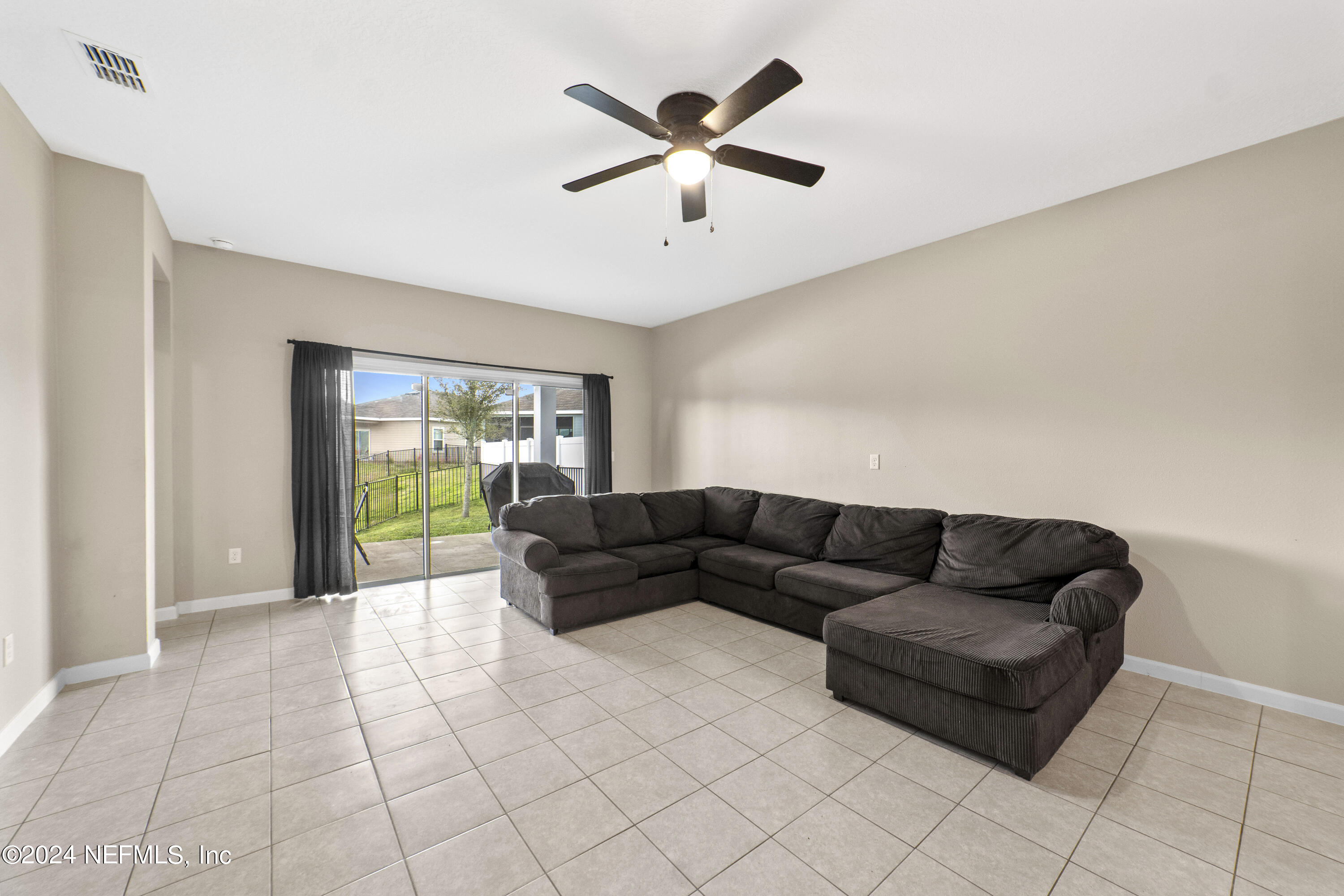 5334 Kellar Circle Jacksonville, FL 32218 - Photo 12 of 23 a living room with furniture and a window