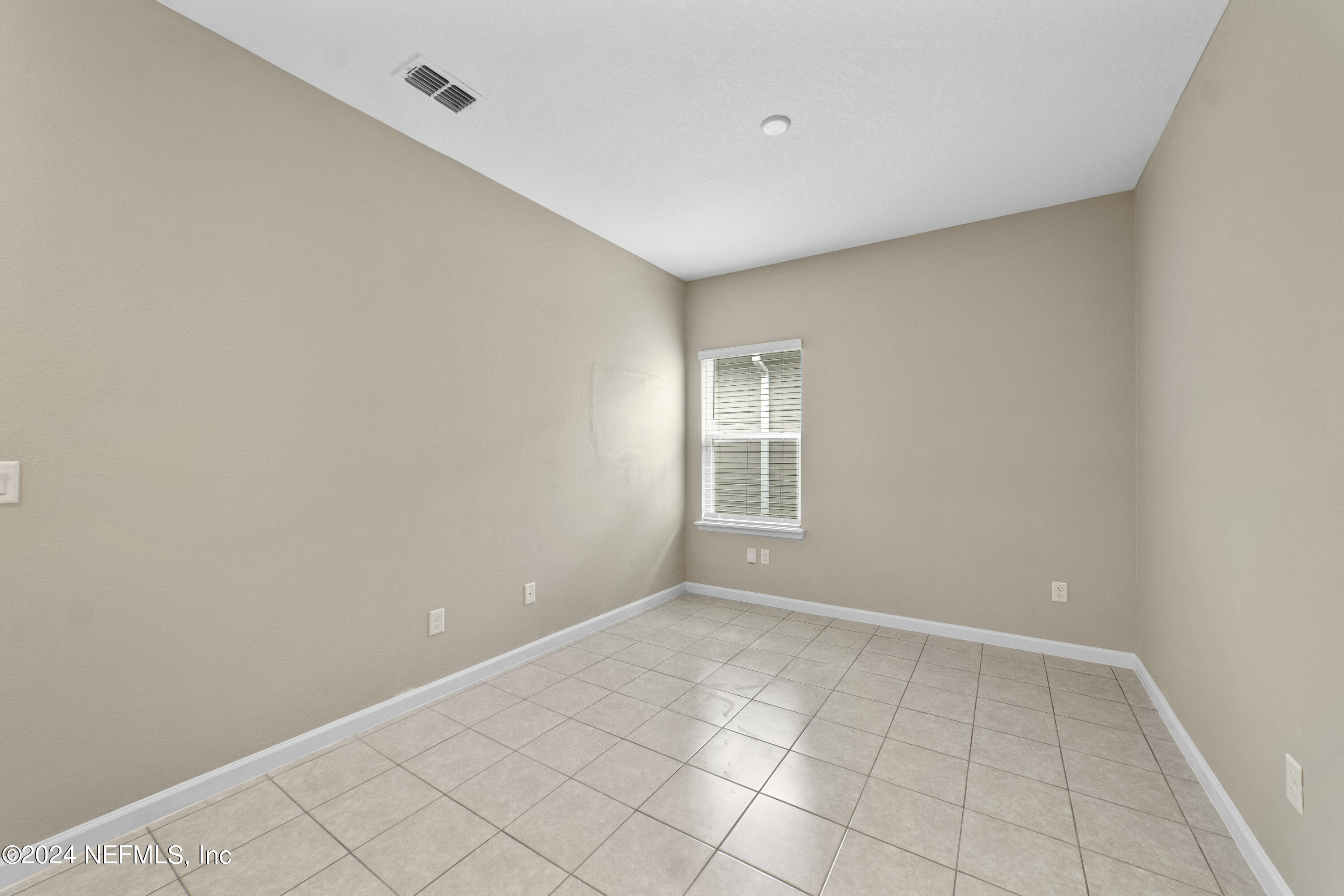 5334 Kellar Circle Jacksonville, FL 32218 - Photo 18 of 23 a view of an empty room with a window
