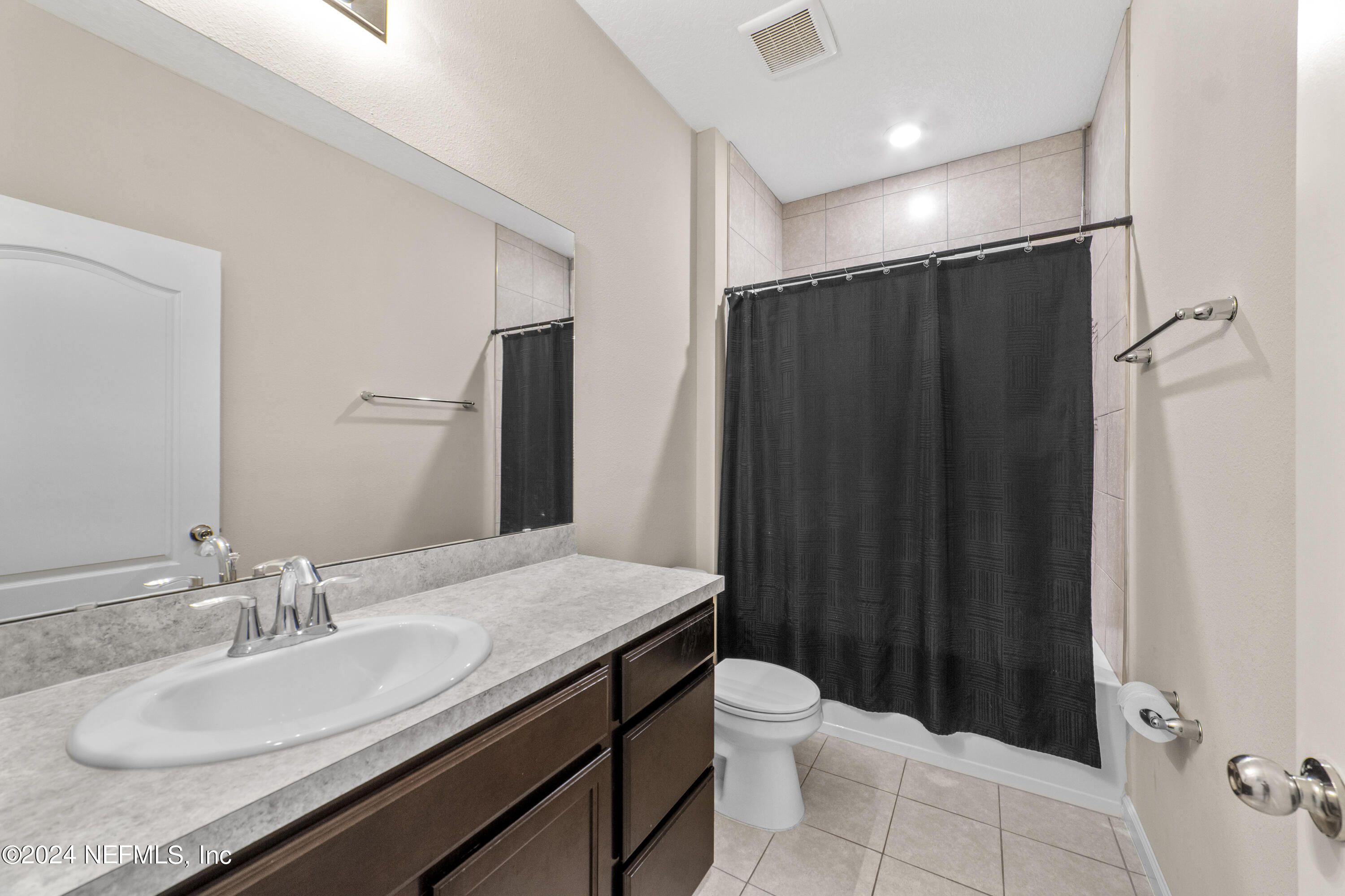 5334 Kellar Circle Jacksonville, FL 32218 - Photo 19 of 23 a bathroom with a granite countertop sink toilet and shower