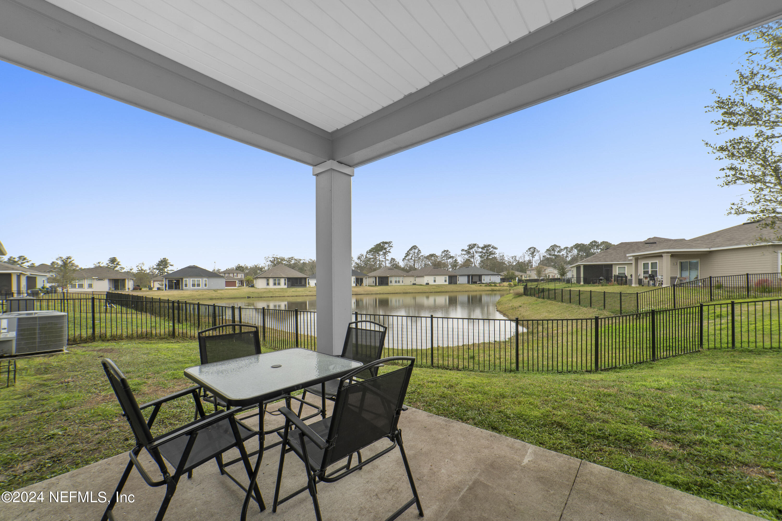 5334 Kellar Circle Jacksonville, FL 32218 - Photo 23 of 23 a view of a lake with table and chairs