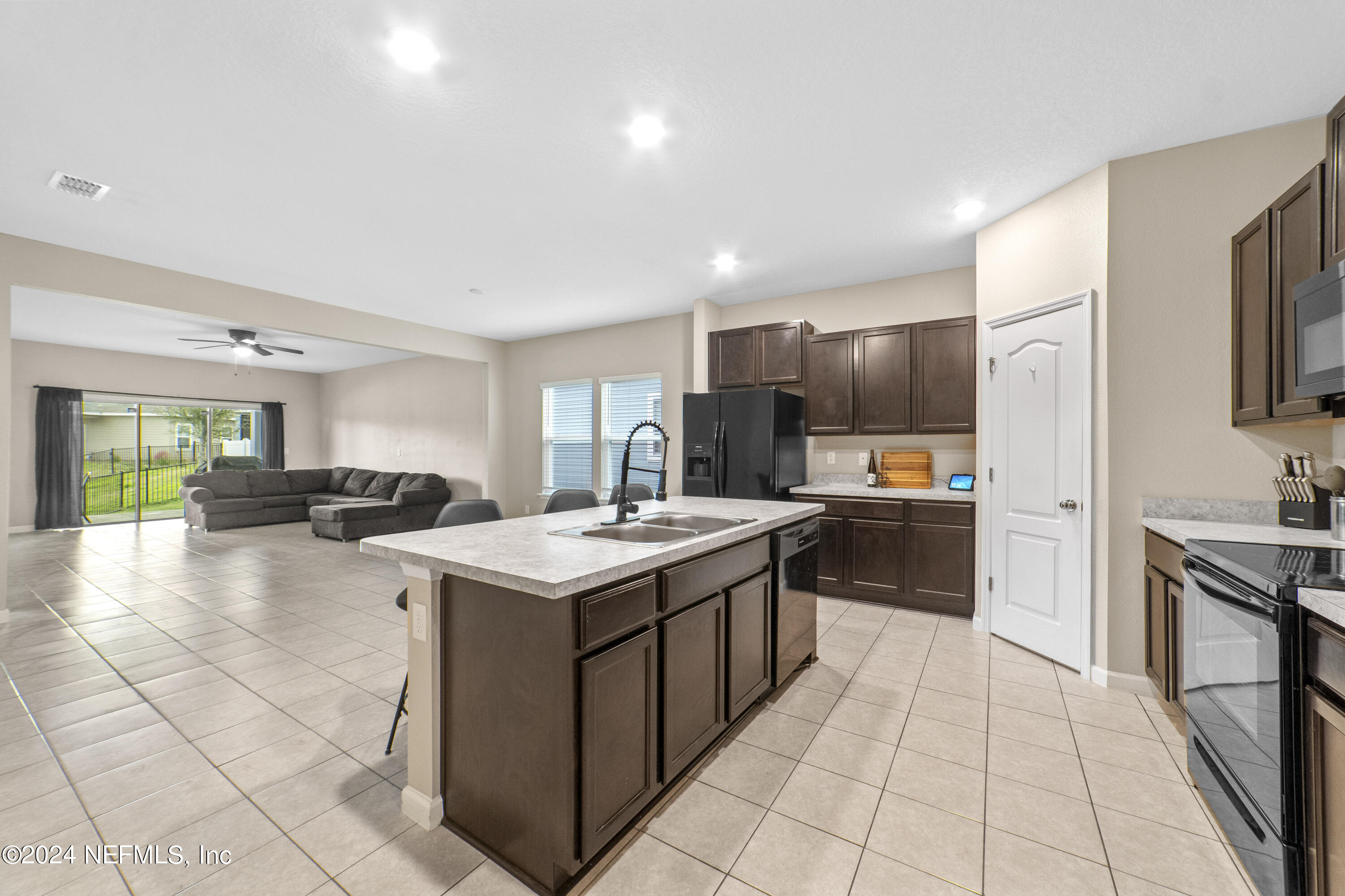 5334 Kellar Circle Jacksonville, FL 32218 - Photo 4 of 23 a kitchen with a sink a stove top oven and cabinets