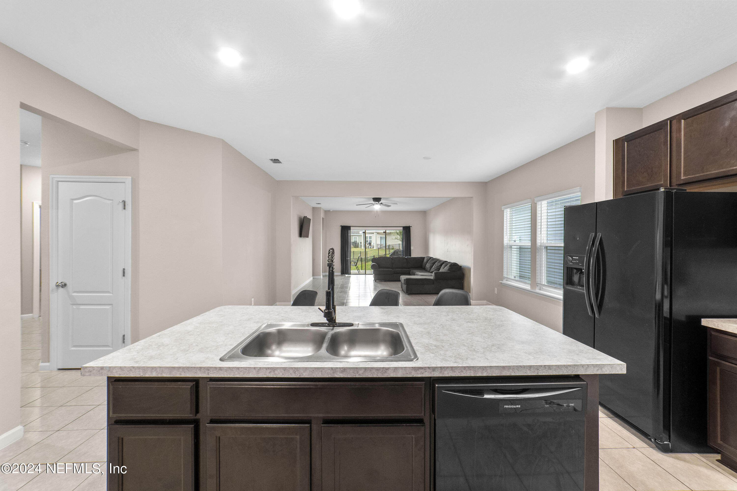5334 Kellar Circle Jacksonville, FL 32218 - Photo 5 of 23 a kitchen with a sink a refrigerator and cabinets
