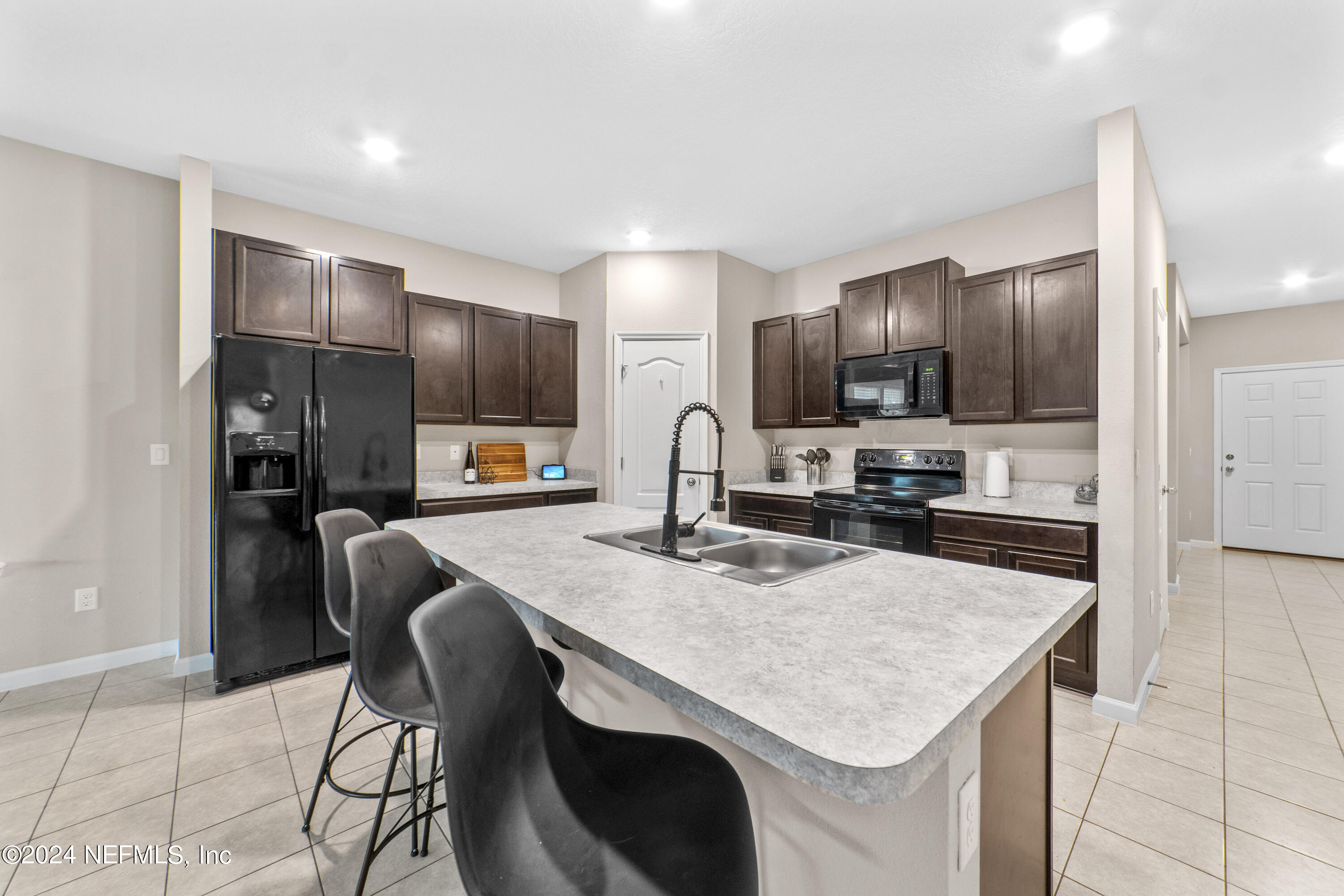 5334 Kellar Circle Jacksonville, FL 32218 - Photo 7 of 23 a kitchen with cabinets and stainless steel appliances
