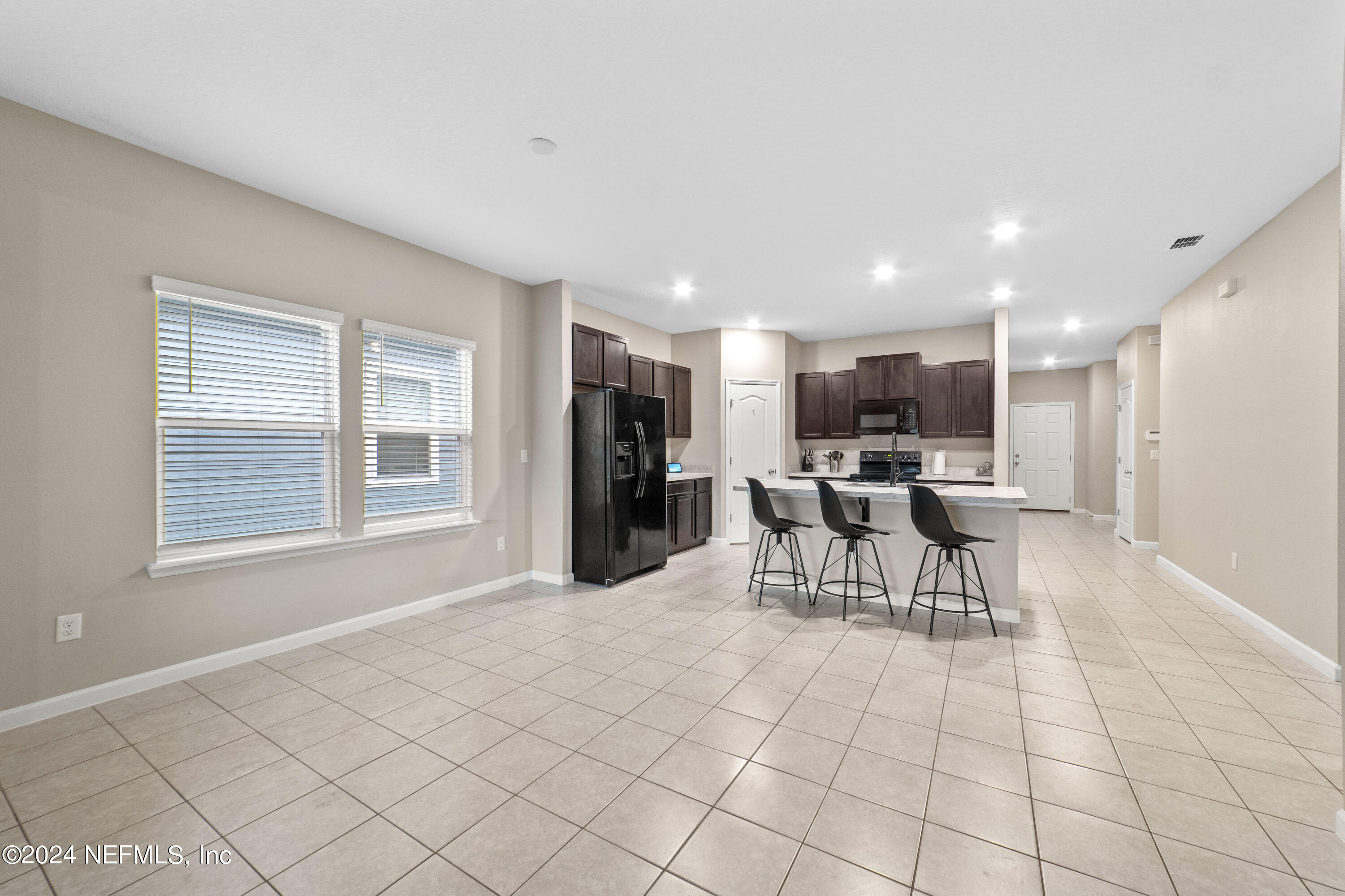 5334 Kellar Circle Jacksonville, FL 32218 - Photo 9 of 23 a view of a kitchen with a dining table and chairs