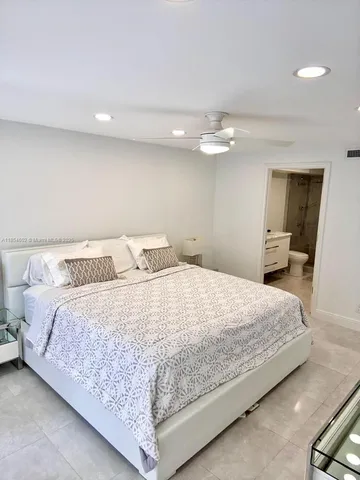 a bedroom with bed and window