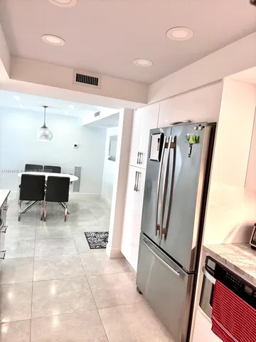 a view of a refrigerator and window