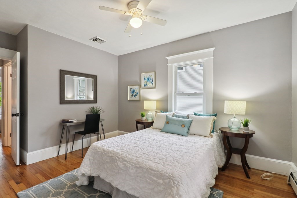 33 Crest Street Springfield, MA 01109 - Photo 12 of 28 a bedroom with a bed and a table