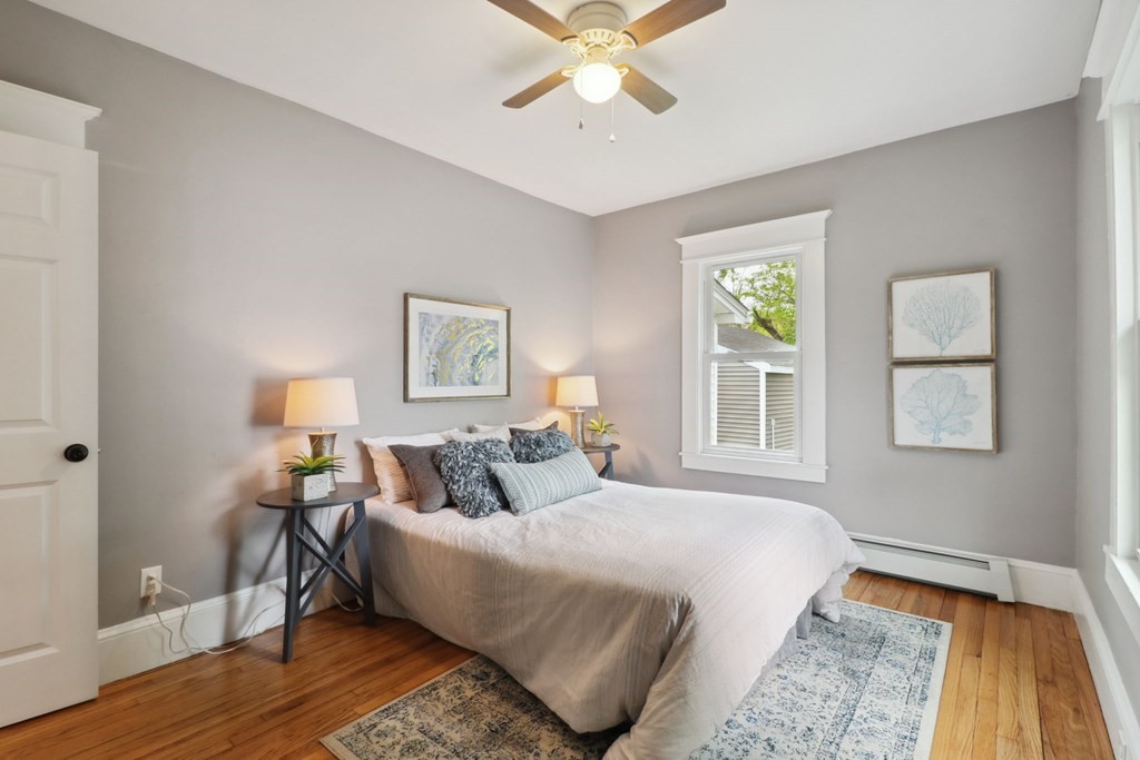 33 Crest Street Springfield, MA 01109 - Photo 17 of 28 a bedroom with a bed and wooden floor