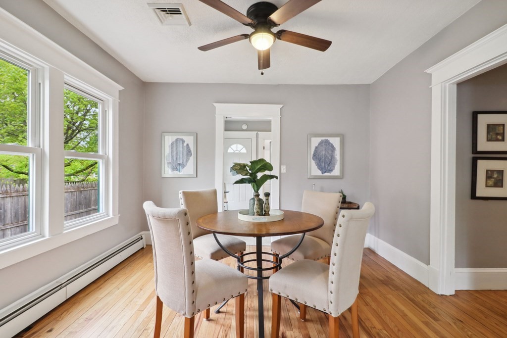 33 Crest Street Springfield, MA 01109 - Photo 5 of 28 a dining room with furniture a window and wooden floor