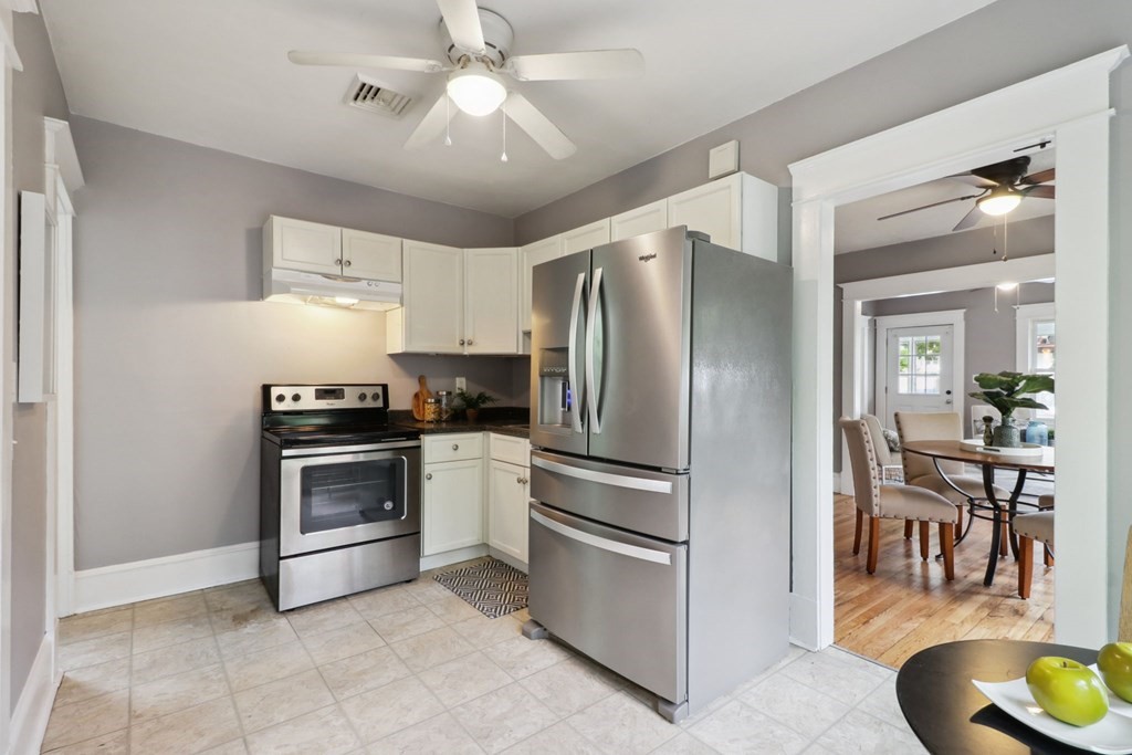 33 Crest Street Springfield, MA 01109 - Photo 8 of 28 a kitchen with stainless steel appliances a refrigerator sink and microwave