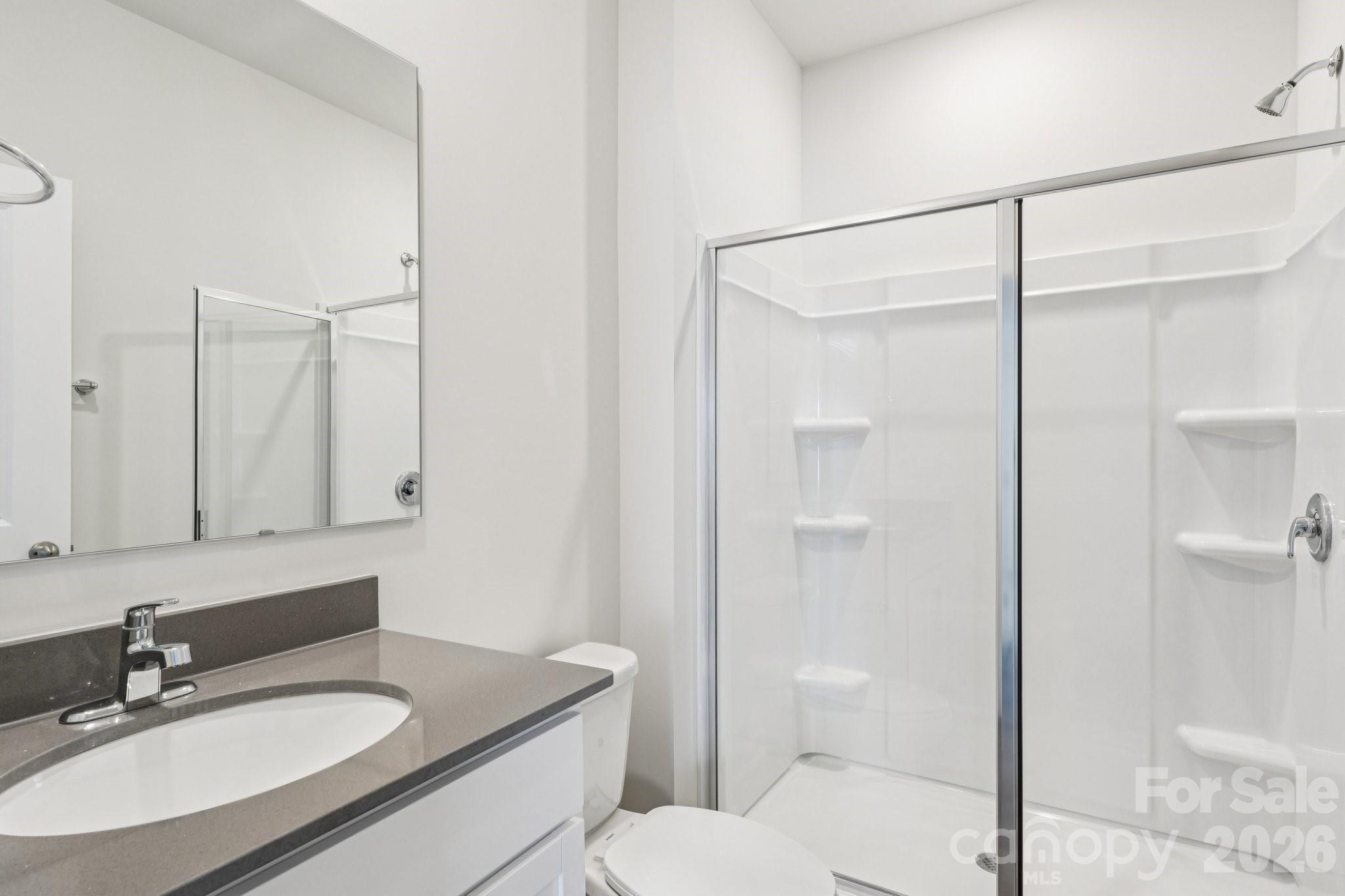 1430 Mammoth Road Hickory, NC 28602 - Photo 11 of 42 a bathroom with a granite countertop sink toilet and shower
