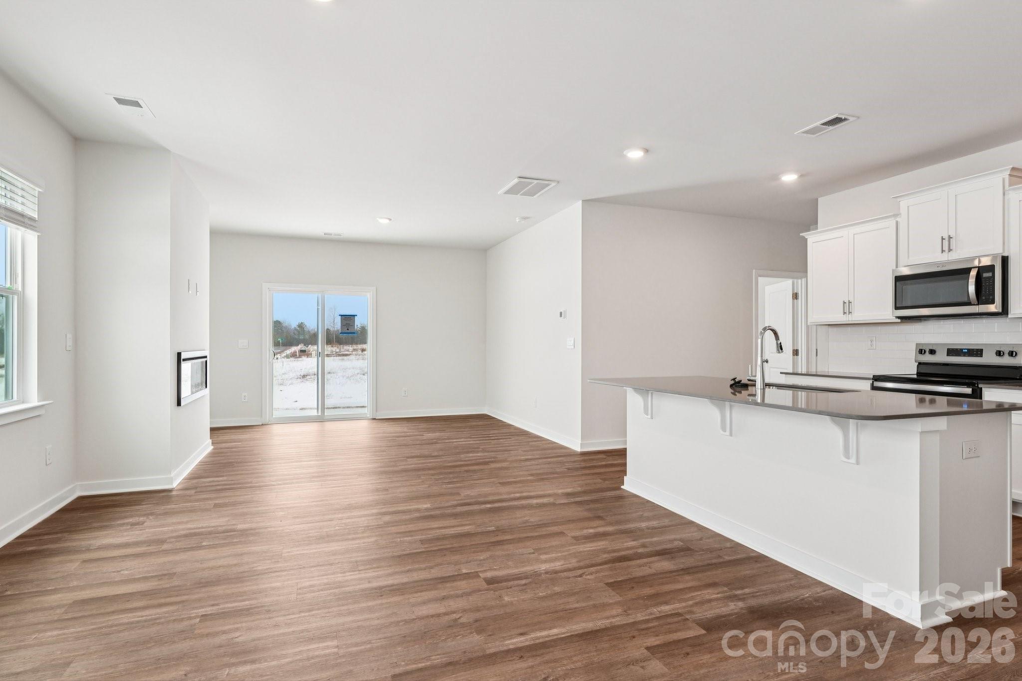 1430 Mammoth Road Hickory, NC 28602 - Photo 4 of 42 a large kitchen with cabinets wooden floor and a stainless steel appliances