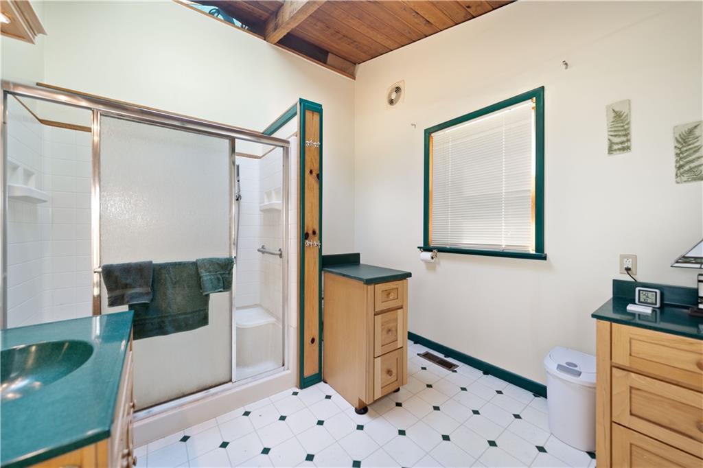 67 Spruce Peak Road Acme, PA 15610 - Photo 19 of 38 a bathroom with a sink and a mirror