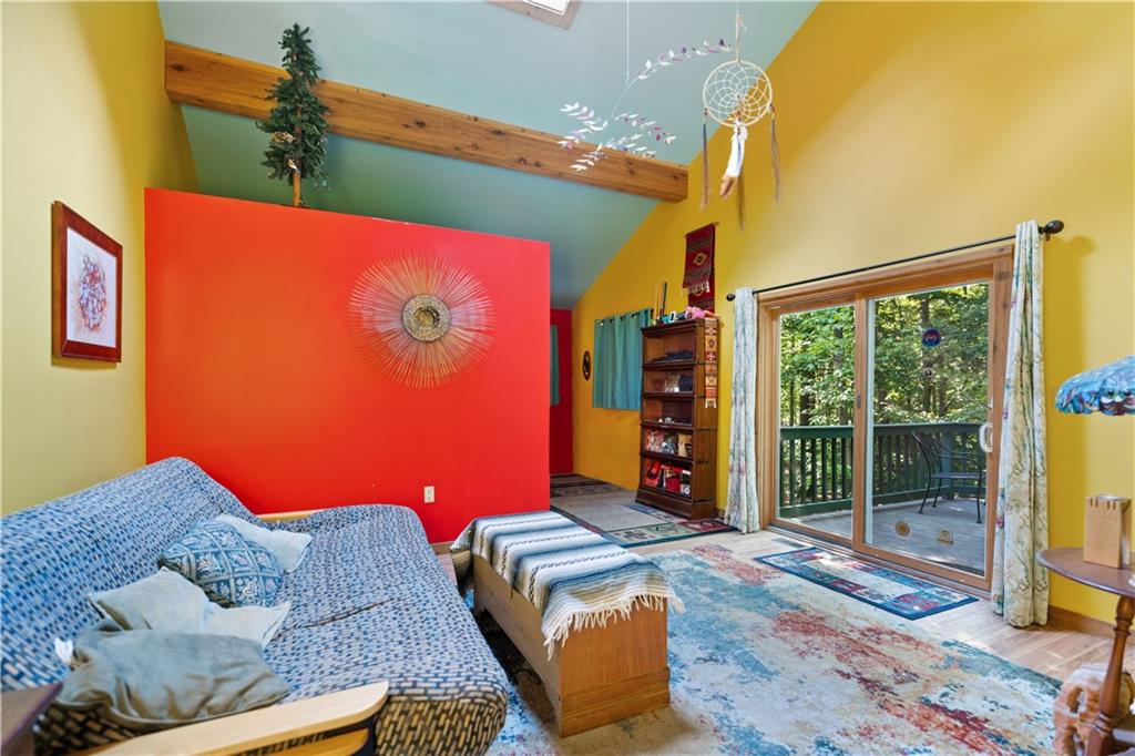 67 Spruce Peak Road Acme, PA 15610 - Photo 23 of 38 a bedroom with a bed and wooden floor
