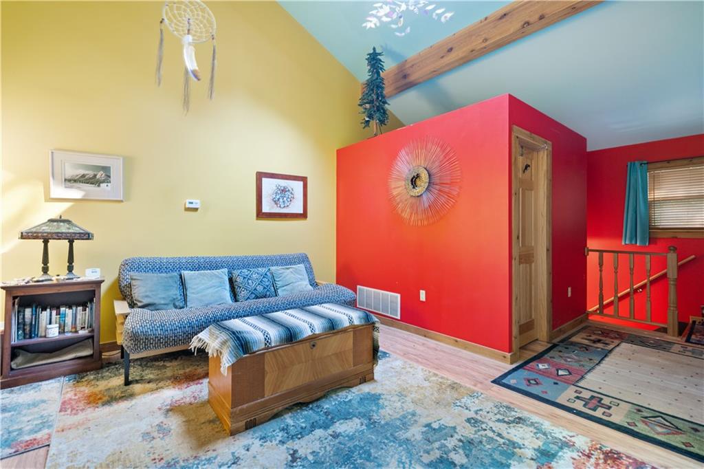 67 Spruce Peak Road Acme, PA 15610 - Photo 24 of 38 a living room with furniture and a rug
