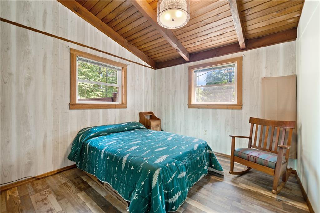 67 Spruce Peak Road Acme, PA 15610 - Photo 27 of 38 a bedroom with a bed and wooden floor